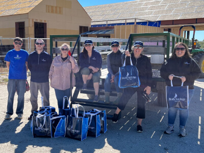 Team with BSI tote bags